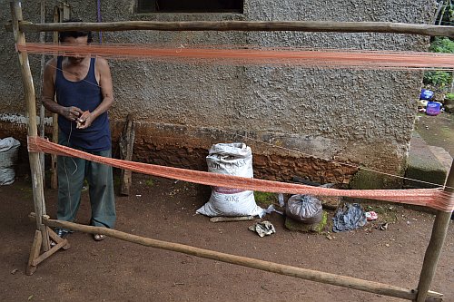 Male hammock weaver