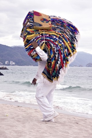 Mexican blanket seller on the beach Mexico