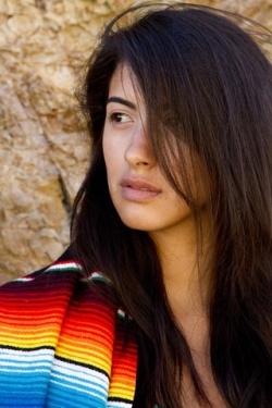 Woman with Mexican serape blanket